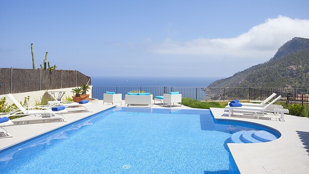 A swimming pool with lounge chairs and a view of the ocean. - Best Views in Mallorca - Villa Marimuntana (Banyalbufar)
