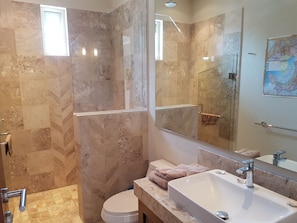 Shower, hair dryer, towels, shampoo