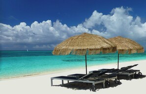 On the beach, sun-loungers, beach towels