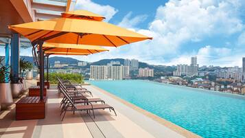 Outdoor pool, open 7:00 AM to 9:00 PM, pool umbrellas, pool loungers