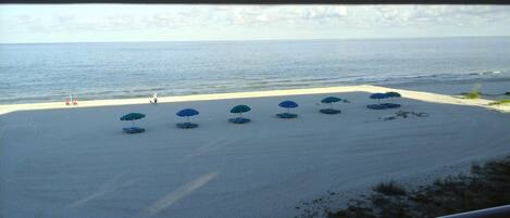 On the beach, sun-loungers, beach towels