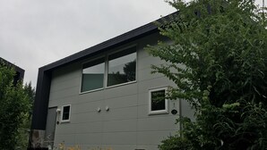 A modern building with a flat roof, large windows, and a grey facade. - Wistaria Karuizawa (Karuizawa)