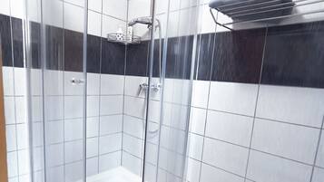 Shower, eco-friendly toiletries, hair dryer, bathrobes