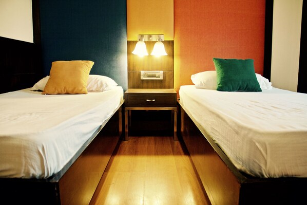 Twin Room, Private Bathroom | 1 bedroom, individually furnished, free WiFi, bed sheets