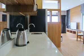 Deluxe Studio | Private kitchenette | Full-sized fridge, microwave, stovetop, electric kettle - CityHub Thailand (Si Racha)