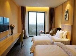 Habitación Elite con 2 camas individuales | Minibar, caja fuerte, escritorio y cortinas opacas