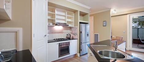 Coffee/tea maker, fridge, microwave, oven
