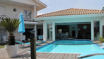 Seasonal outdoor pool, open 10:00 AM to 7:30 PM, pool umbrellas