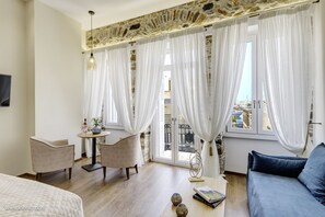 Superior Suite, Partial Sea View | 1 bedroom, premium bedding, memory-foam beds, free minibar