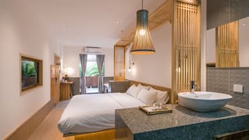 Deluxe King Room with Garden View | Premium bedding, pillow-top beds, in-room safe, blackout curtains