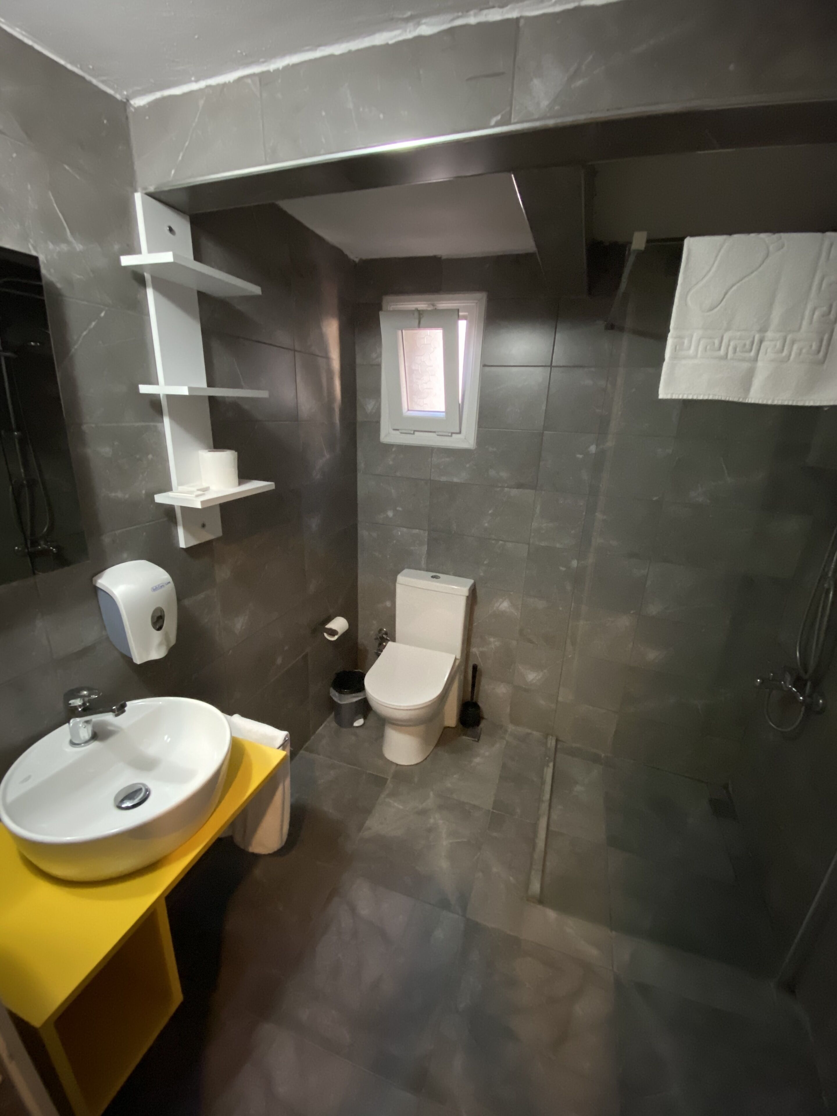 economy double room (exterior private bathroom) | bathroom | shower, hair dryer, slippers, towels