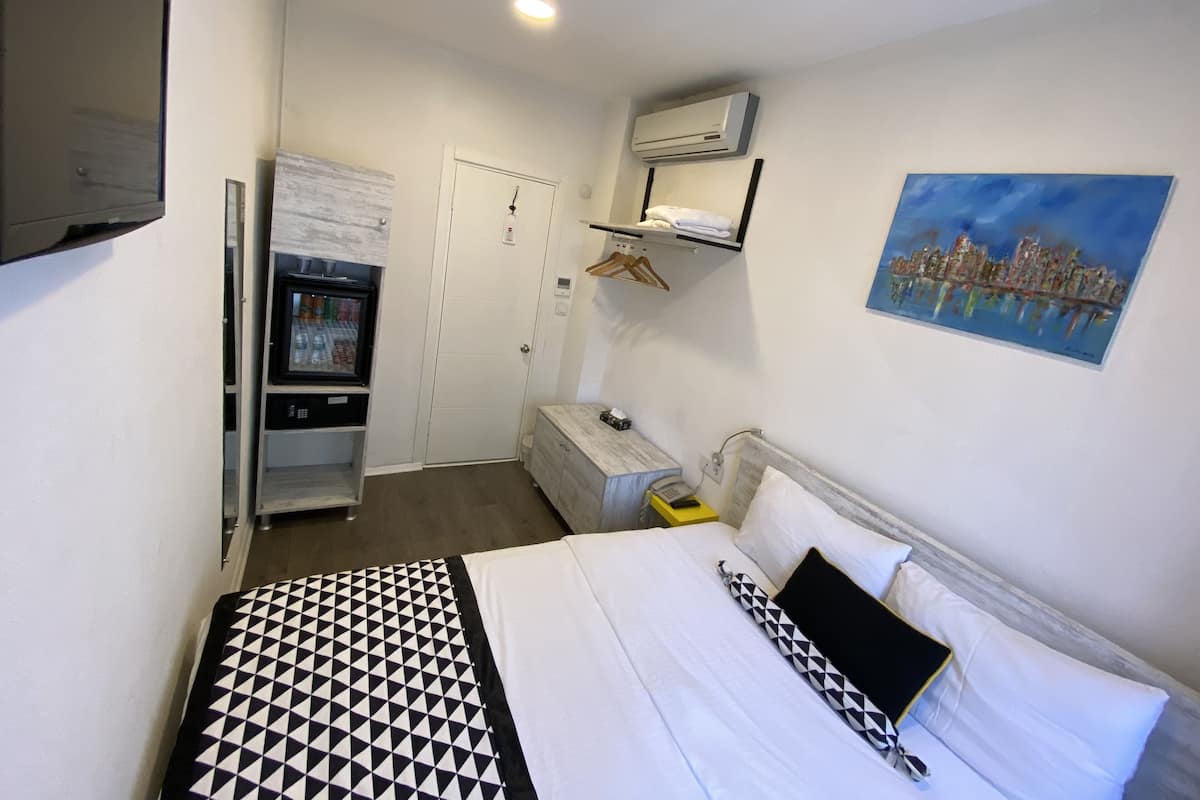 Economy Double Room (Exterior Private Bathroom) | Minibar, in-room safe, blackout drapes, soundproofing