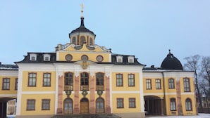 A large, yellow building with a central dome and a smaller dome on the right. - Hummel Hostel (Weimar)