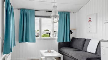 Cottage (Excluding Towels, Sheets and Cleaning) | Living area | Flat-screen TV, table tennis