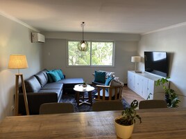 Family Apartment, 3 Bedrooms, Garden View | Living area | 43-inch flat-screen TV with cable channels, LED TV