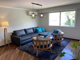 Family Apartment, 3 Bedrooms, Garden View | Living area | 43-inch flat-screen TV with cable channels, LED TV