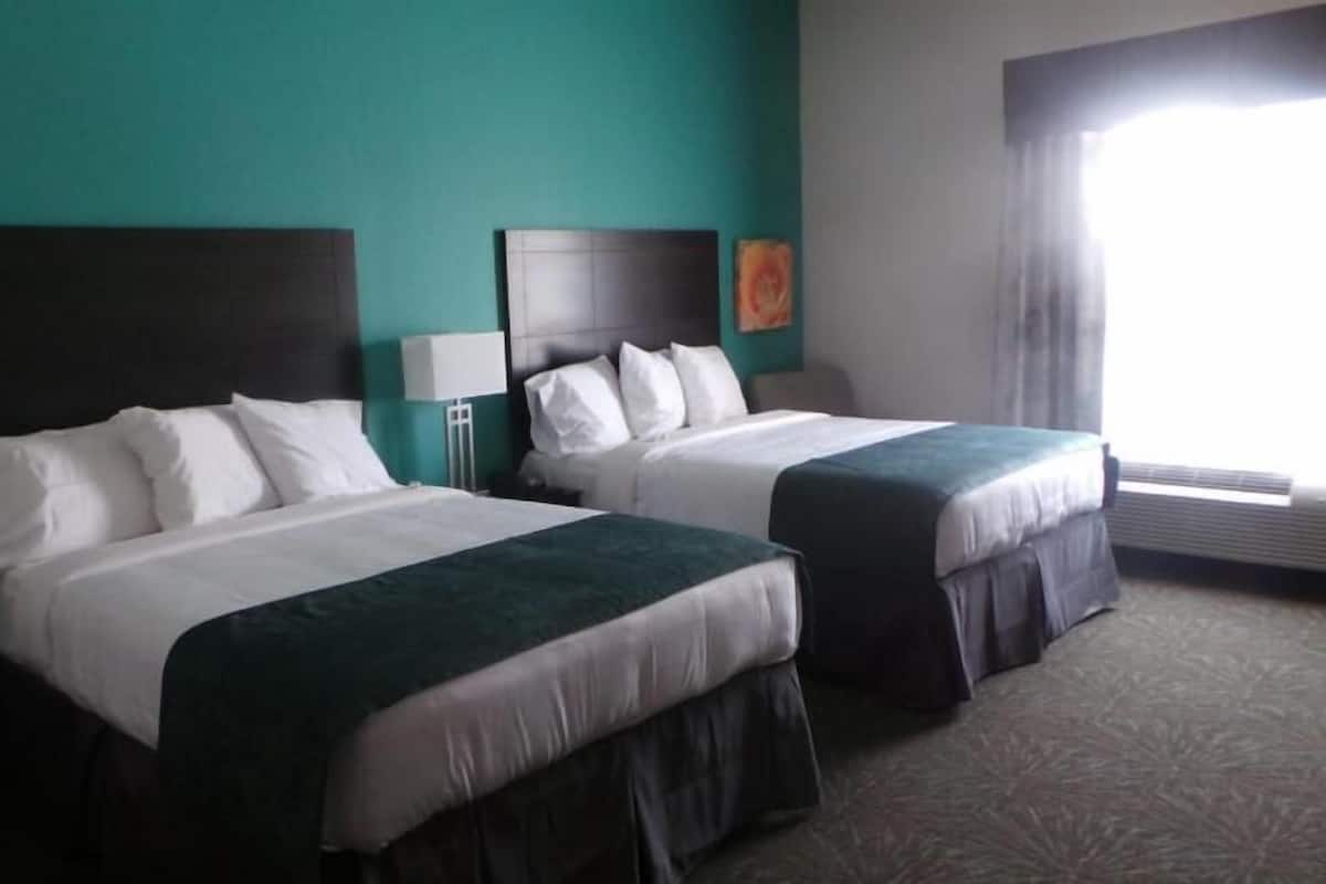 Pillow-top beds, desk, laptop workspace, free rollaway beds