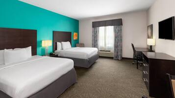 Pillow-top beds, desk, laptop workspace, free rollaway beds