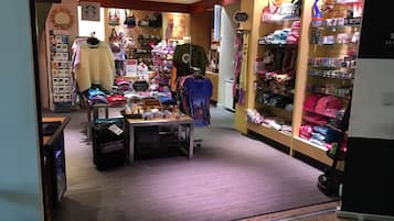 A retail store with various merchandise including clothing, bags, and accessories.