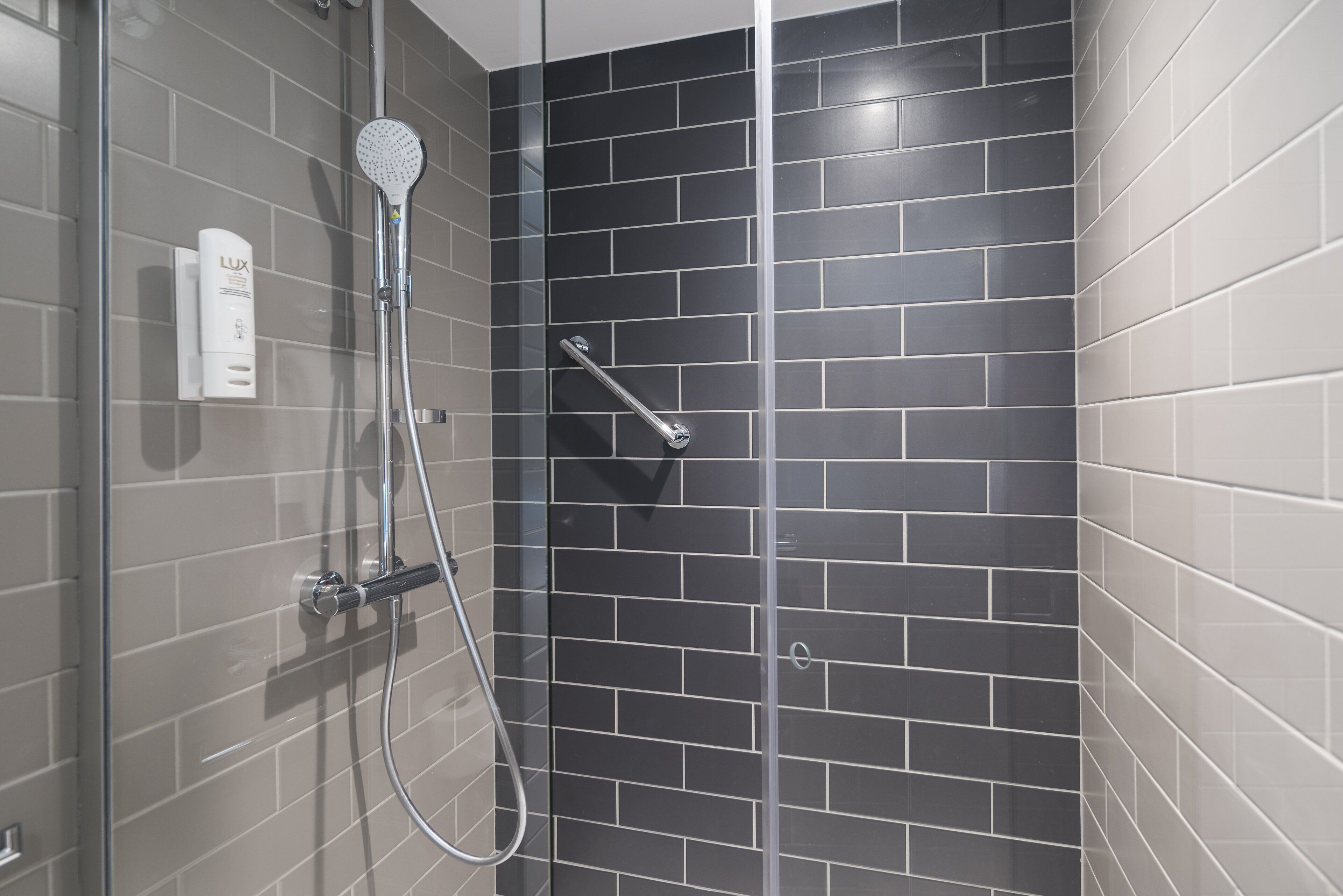 shower, eco-friendly toiletries, hair dryer, towels