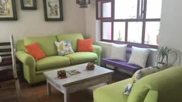 32-inch flat-screen TV with cable channels, TV