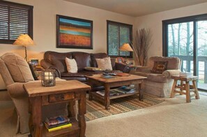Deluxe Condo, 2 Bedrooms | Living room | TV, fireplace - Sleeping Indian by JHRL (Teton Village)