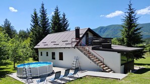 A house with a swimming pool, outdoor seating, and a staircase leading to a deck. - Entire House with Hot Tub Just For You -  Plitvice Lakes (Plitvička Jezera)