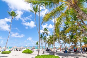 On the beach, sun-loungers, beach towels