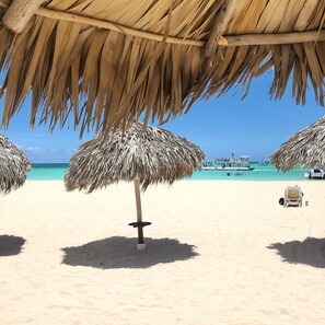 On the beach, sun-loungers, beach towels