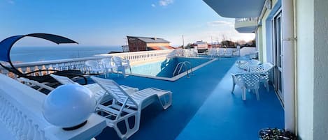 Outdoor pool, sun loungers