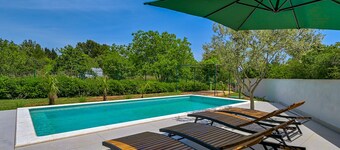 Modern house in a quiet location with a fenced garden, porch and private pool