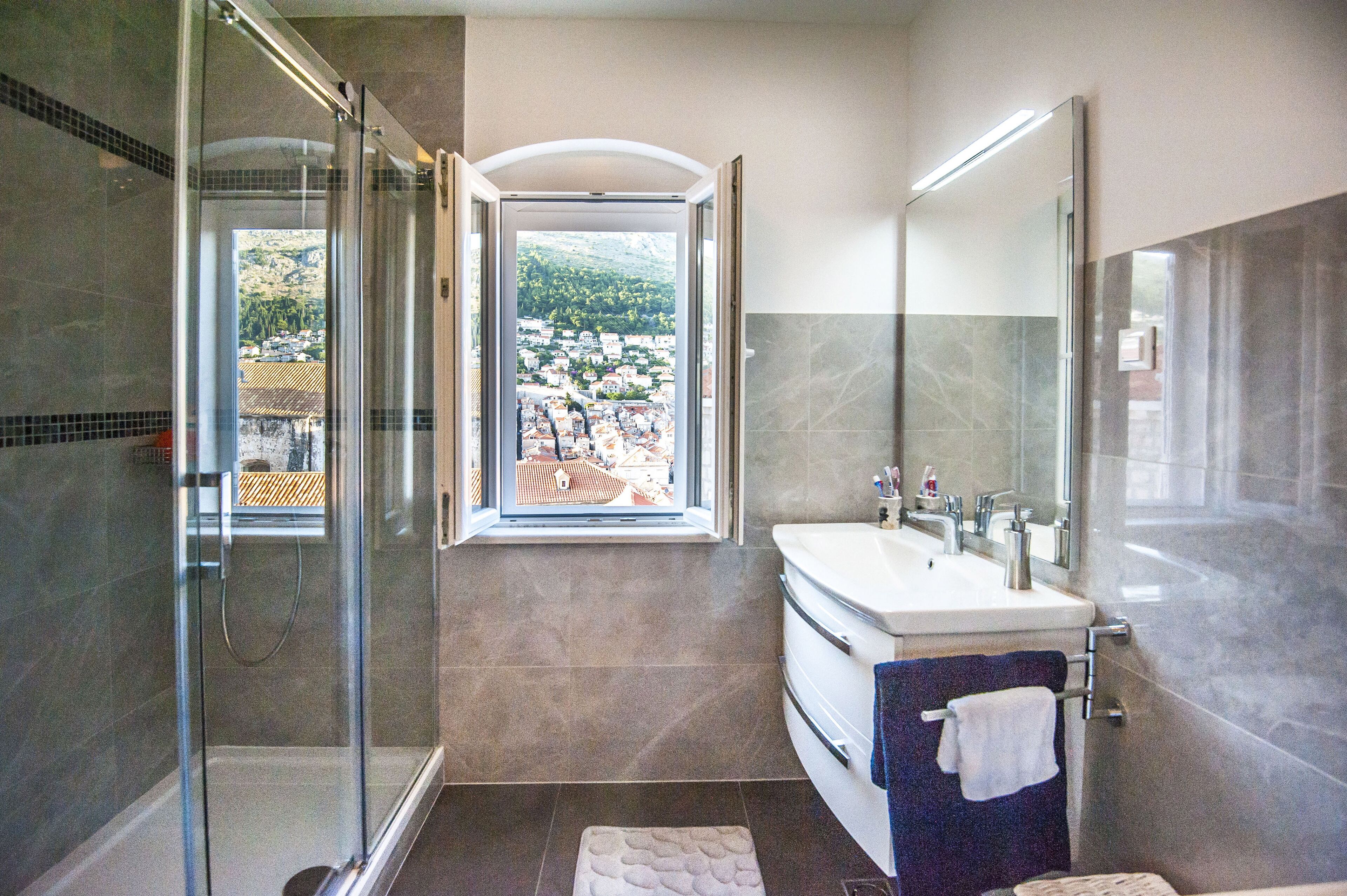 Shower, hair dryer, towels, shampoo