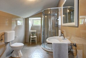 Bathtub, hair dryer, towels, soap