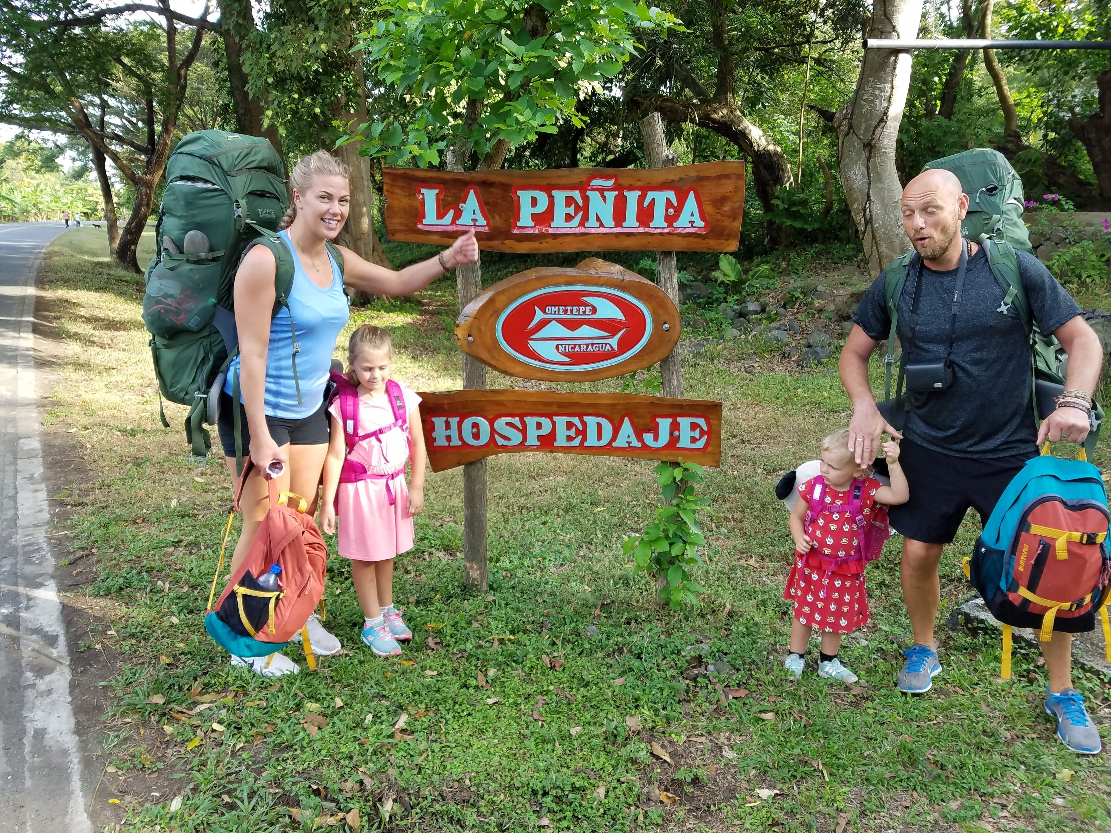 A signpost with 'LA PENITA' and 'HOSPEDAJE' indicating a location in Nicaragua.