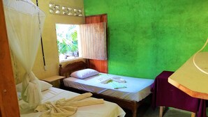 A room with two beds, a window with a curtain, a bedside table, and a lamp. - Real family hostel, Hospedaje La Penita, 2 person room  (Altagracia)