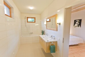 Combined shower/tub, hair dryer, towels, toilet paper