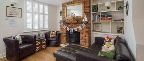 Smart-tv, een open haard, Netflix en boeken