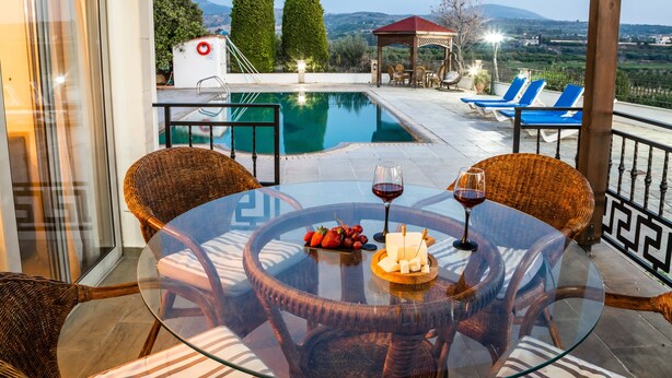 A glass-top table with wicker chairs, a pool, and a gazebo with blue lounge chairs. - VILLA DEMETRA (4 ensuite bedrooms,  stunning view,BBQ,HighSpeed WI-FI,swim.pool) (Argaka)