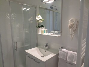 Shower, hair dryer, towels, soap