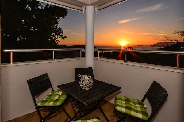 Evenings at the balcony wth sunset and Dubrovnik in behind
