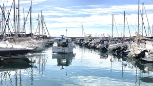 A marina with numerous boats docked. - Spacious quiet apartment 450 meters to the beach, huge patio, communal pool. (Torre del Mar)