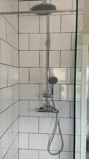 Shower, eco-friendly toiletries, hair dryer, towels