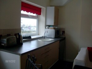 Fridge, microwave, electric kettle, toaster