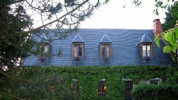 A house with a steeply pitched roof, multiple windows, and a covered porch area. - Charming House, Edge of the Golf, Sea, Countryside, Peaceful (Seine-Maritime)