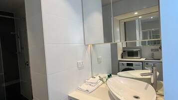 Apartment, 1 Bedroom | Bathroom | Shower, free toiletries, hair dryer, towels