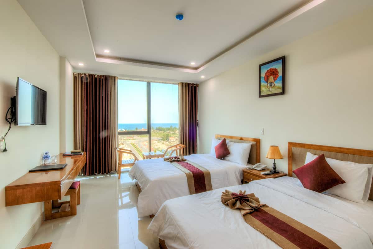 Kamar Twin Deluks, 1 kamar tidur, Bebas Asap Rokok, pemandangan samudra | 1 kamar tidur, minibar, brankas, dan meja kerja