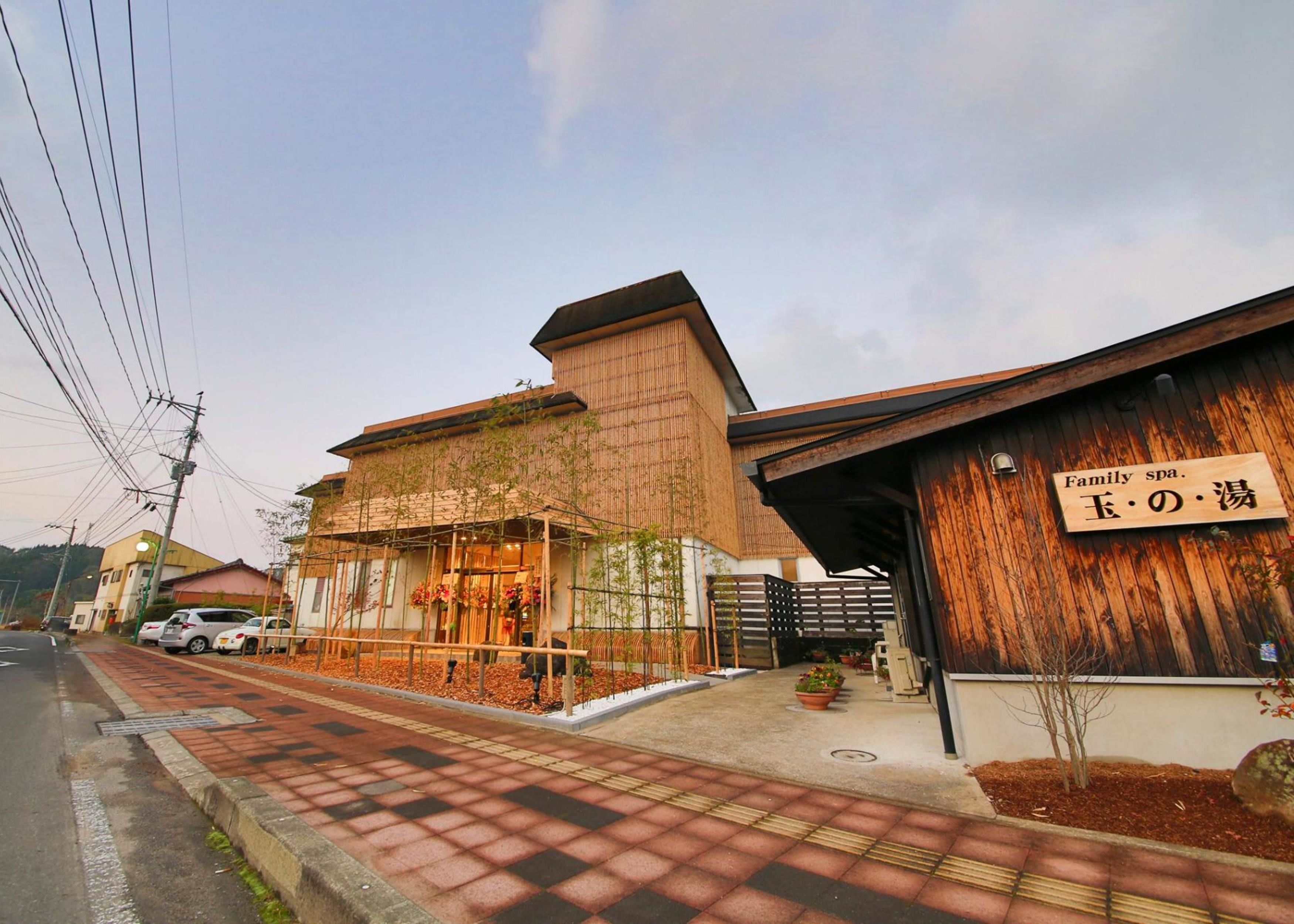 A building with a sign reading "Family spa." and another sign with Japanese characters.