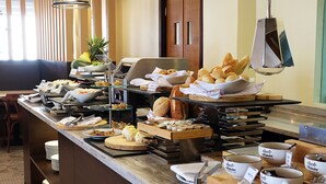 A buffet with various food items and a coffee station. - Altabriza Resort Boracay (Boracay Island)