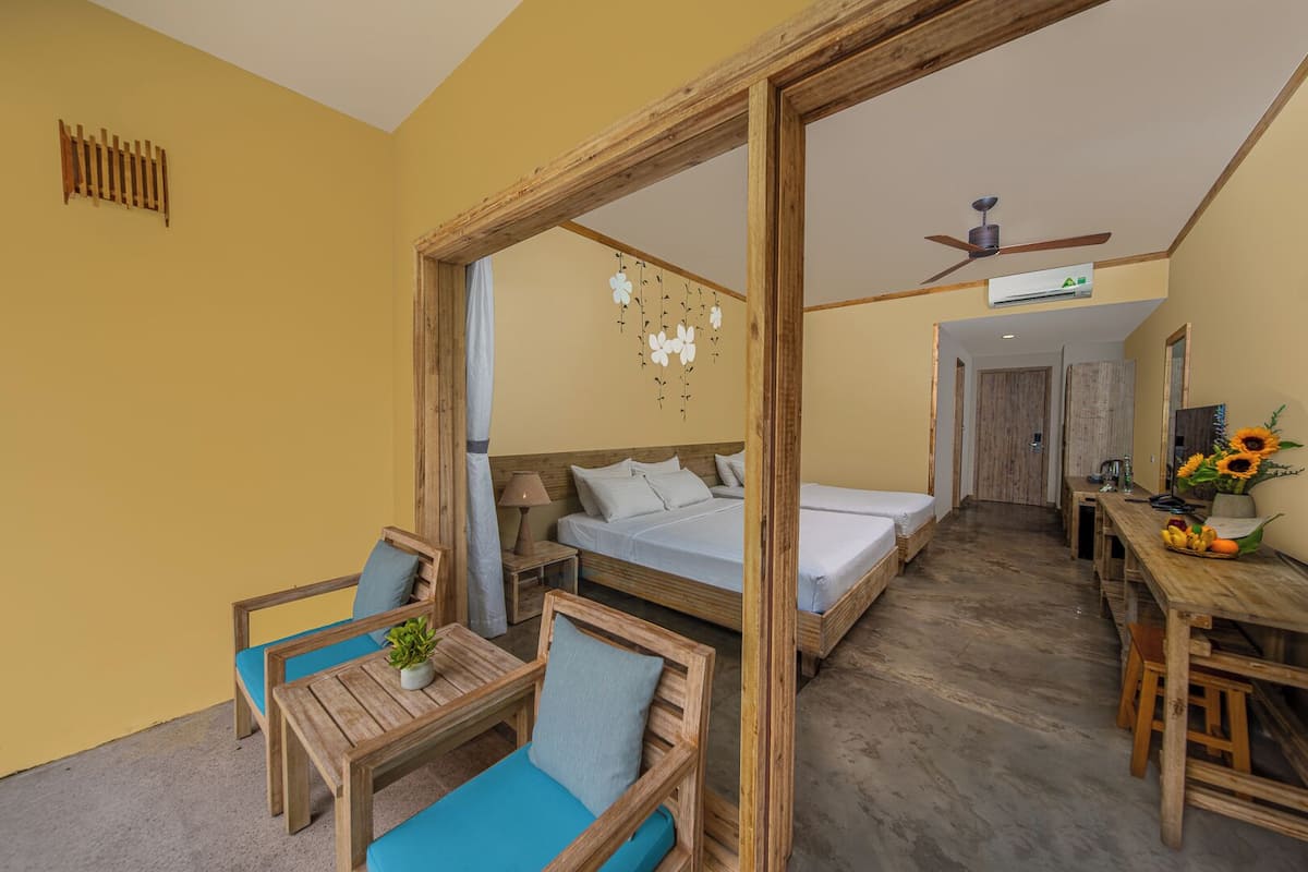Deluxe Triple Room, Garden View | Balcony view