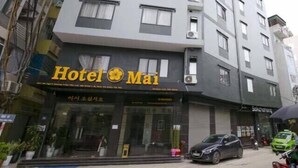 A multi-story building with a sign for 'Hotel Mai' at the ground level. - K Business 3 Hotel (Formerly Mai Hotel) (Hanoi)